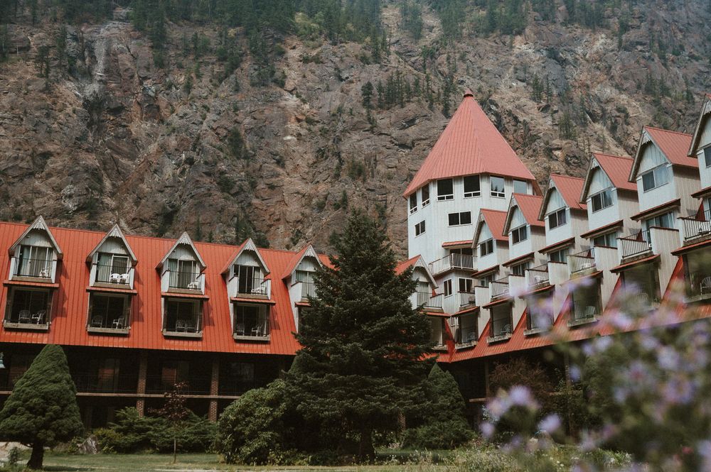 A unique mountain resort building with orange-red roofs and distinctive architectural features.