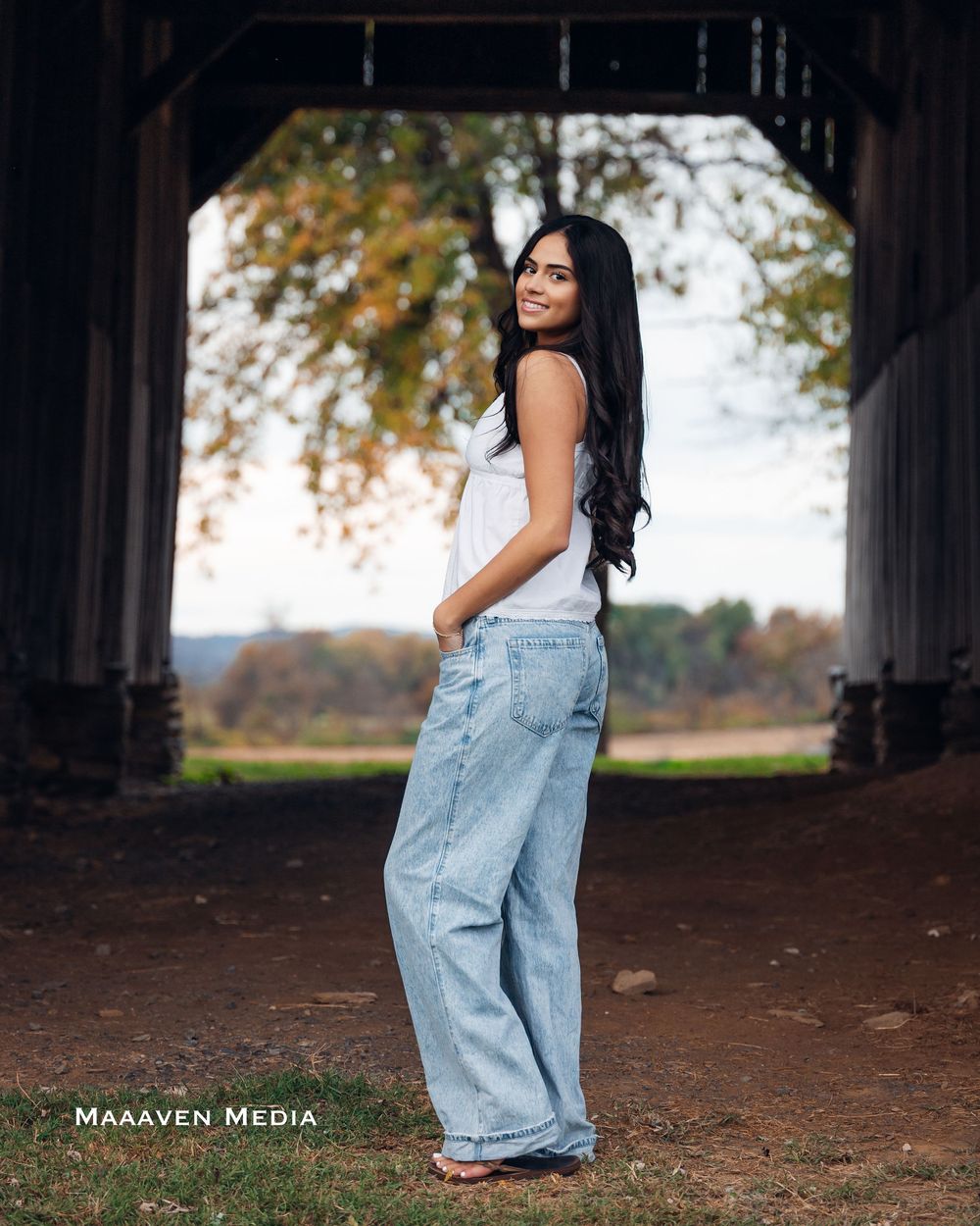 A series of outdoor portrait photographs showing someone in loose-fitting denim overalls against a natural backdrop.