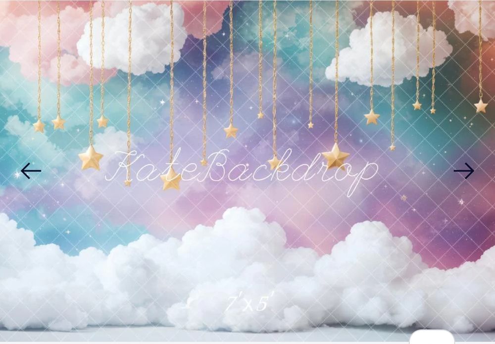 Dreamy backdrop with clouds, stars and text in pastel pink and blue tones.