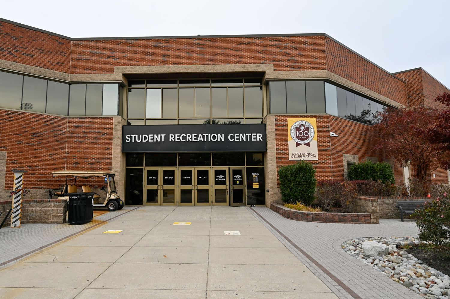 Exterior view of a brick Student Recreation Center building with glass entrance doors.