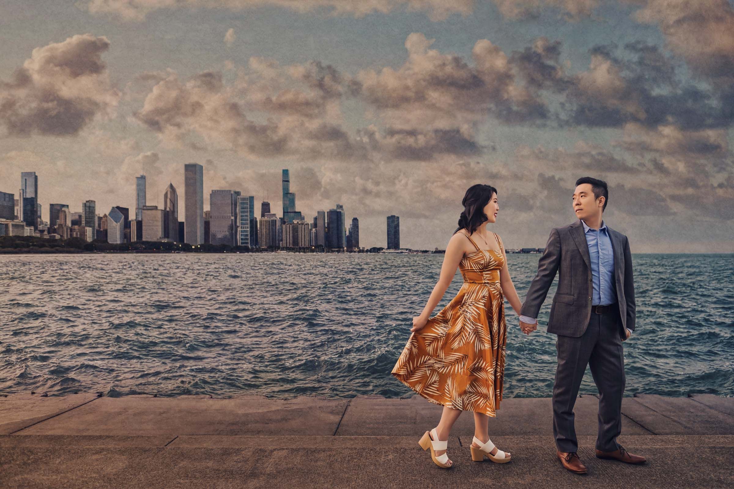A couple poses for romantic sunset photos with Chicago's skyline in the background at North Avenue Beach.