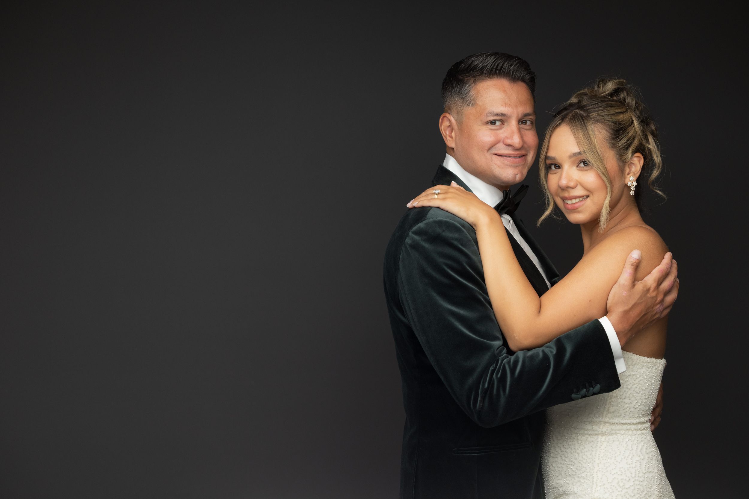 A collection of romantic black and white wedding photos showing tender moments between a couple in formal attire.