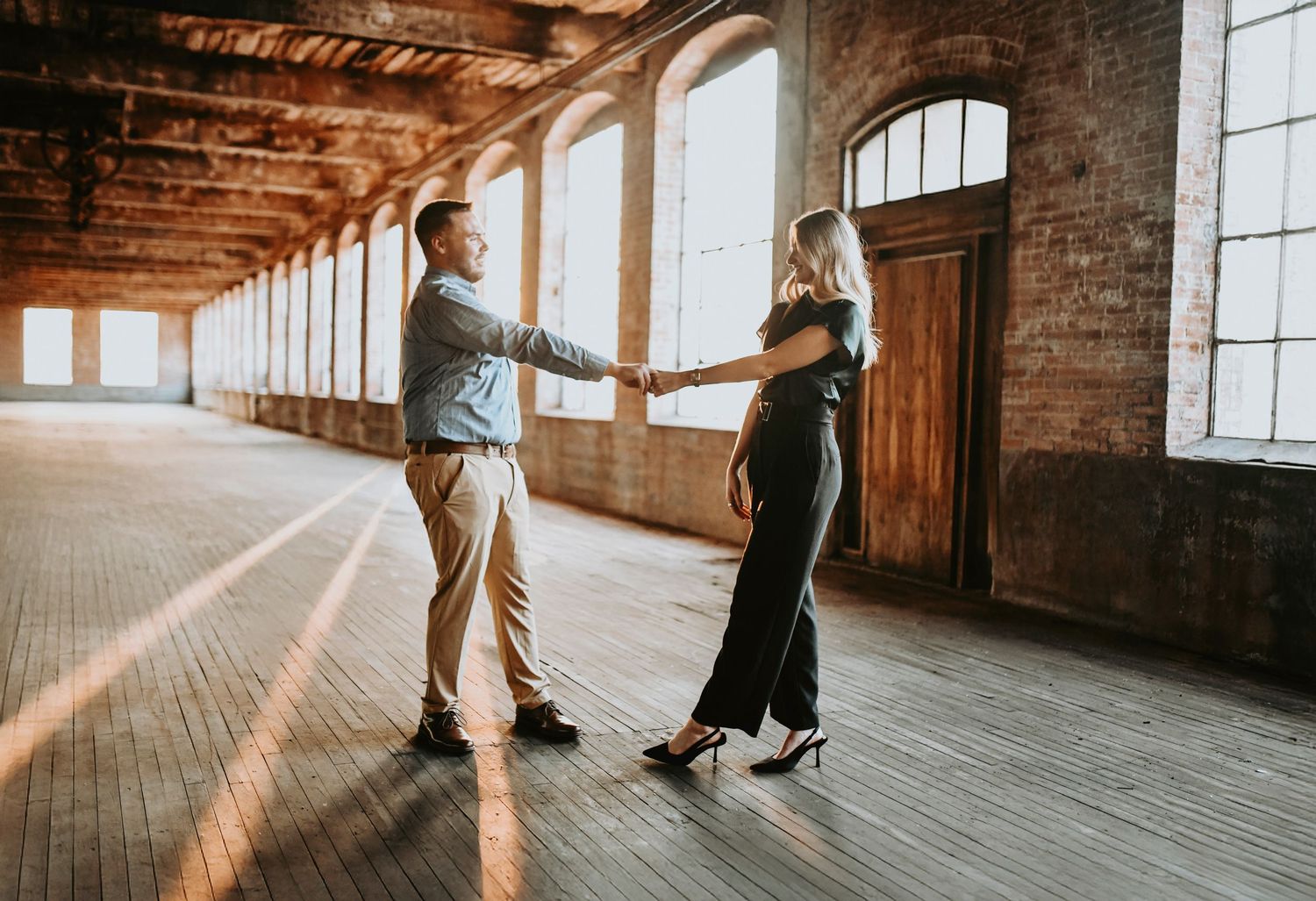 Romantic walk hand in hand after proposal at Cotton Mill McKinney