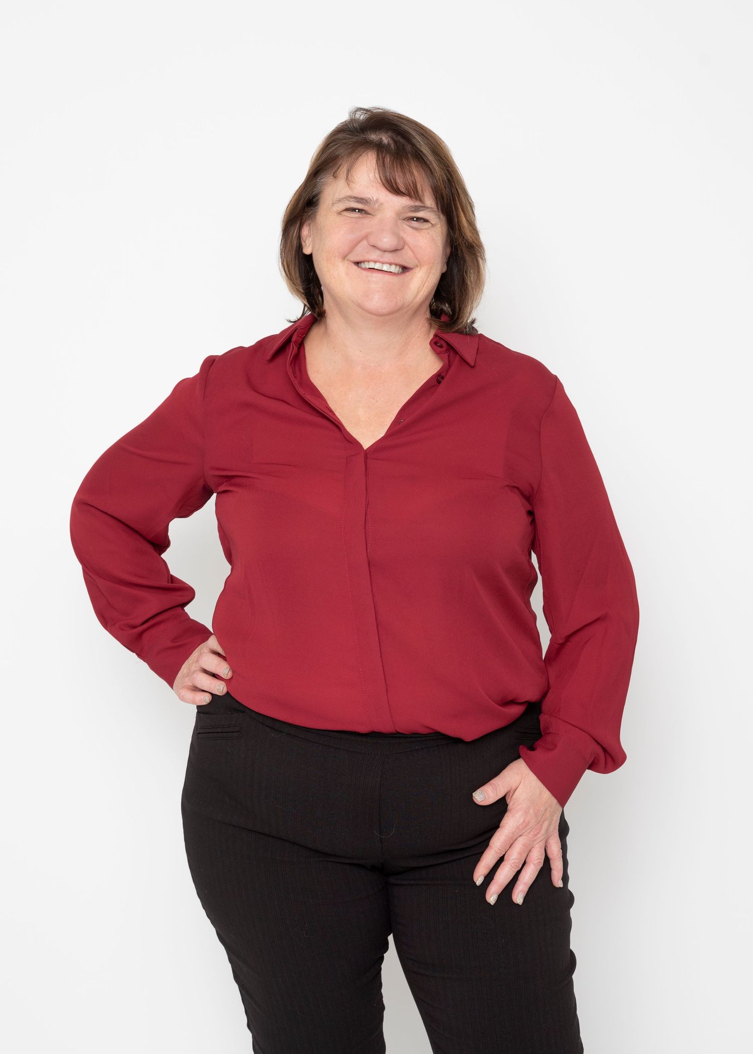 A person wearing a red long-sleeved blouse and black pants shown in four similar poses against a white background.