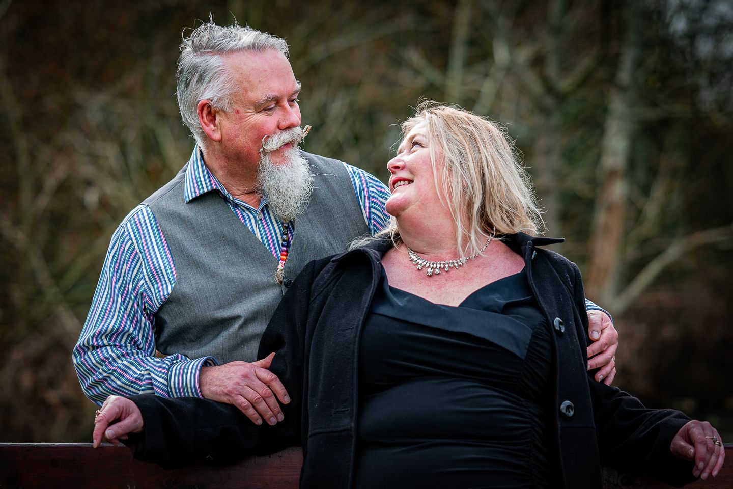 Older Couple pose outside, sharing their love by Poole, Bournemouth and Dorset wedding photographer "kris the photographer"