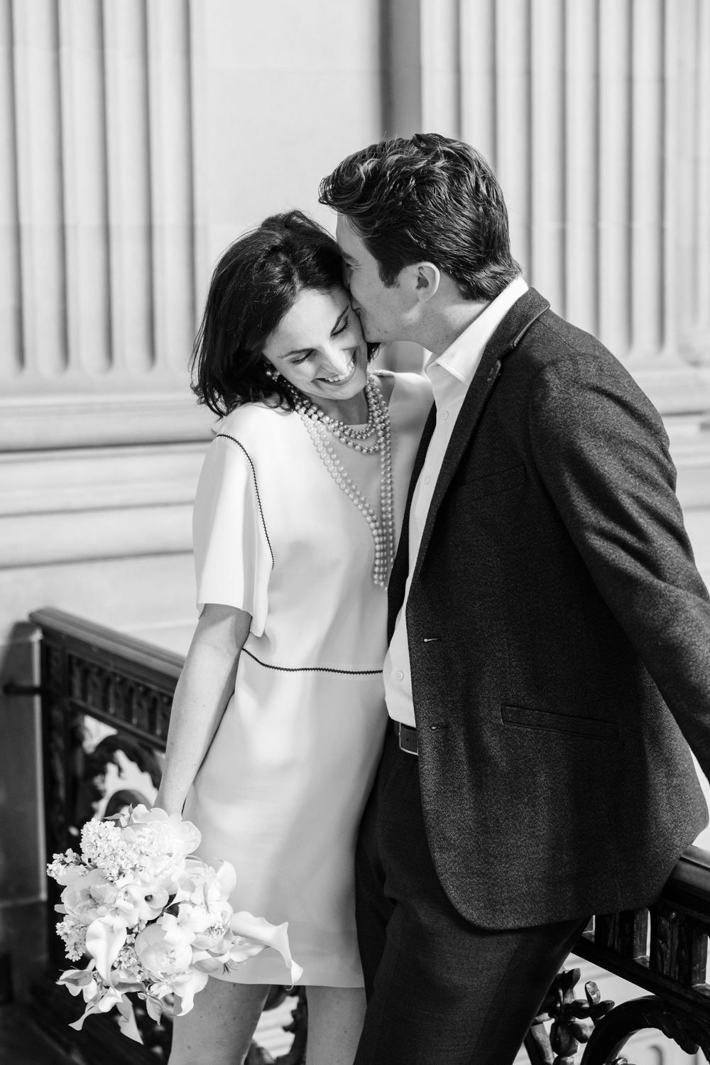 Black and white portrait sequence of a romantic couple in formal attire sharing intimate moments in a classic setting.