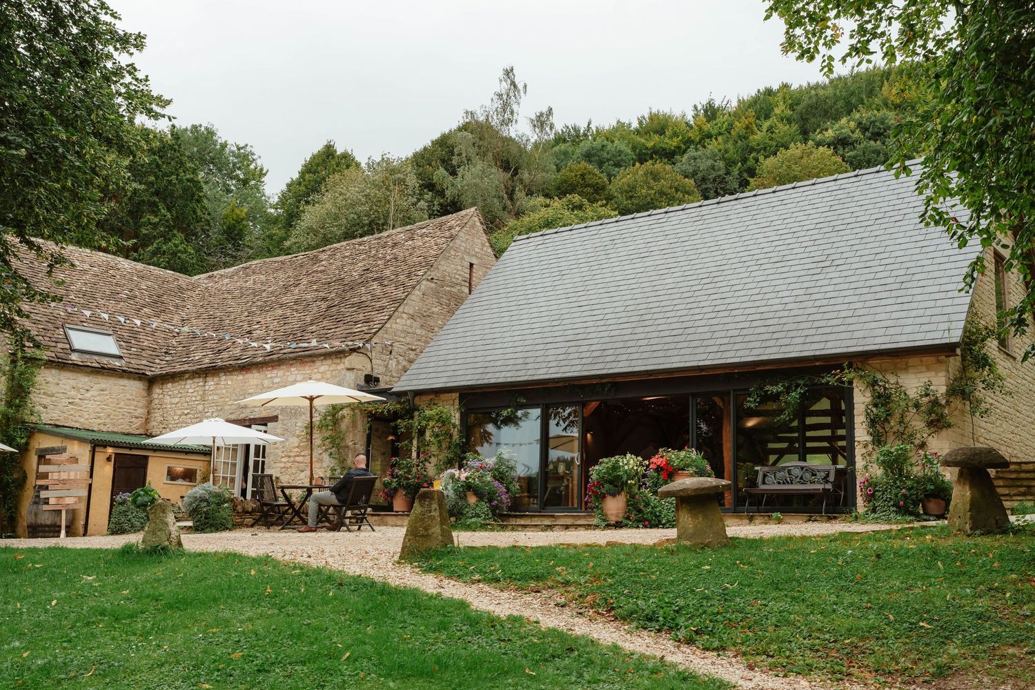 Owlpen Manor Weddings Photographer Zara Davis Photography Cotswolds Uley Cheltenham Gloucestershire front of barn building