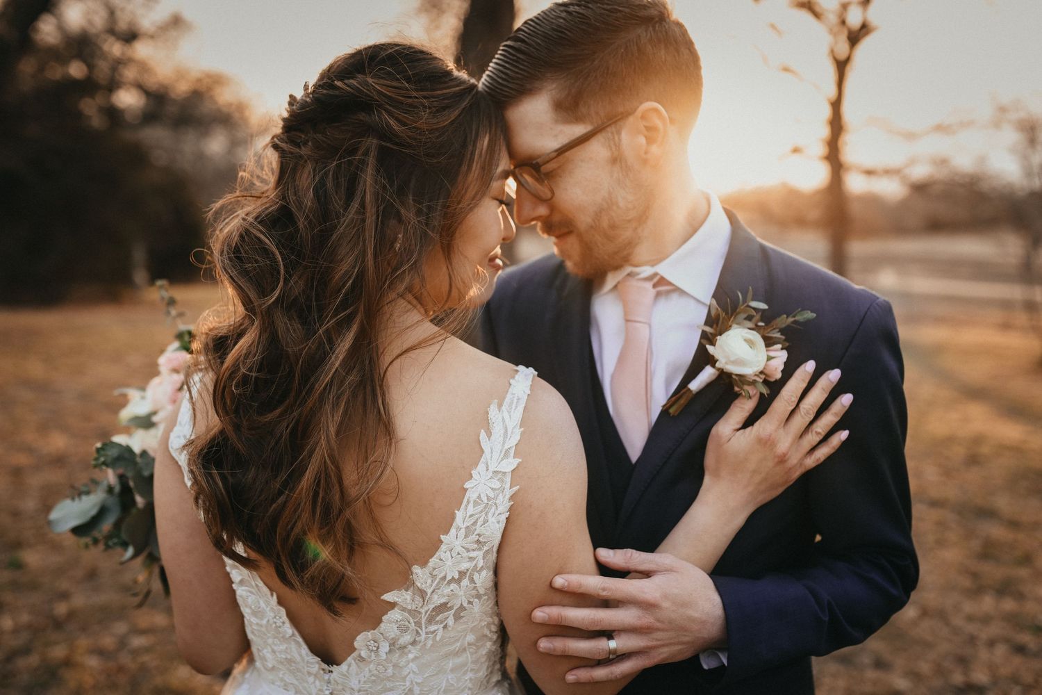 sundrenched photo of bride and groom at oak and ivy wedding venue