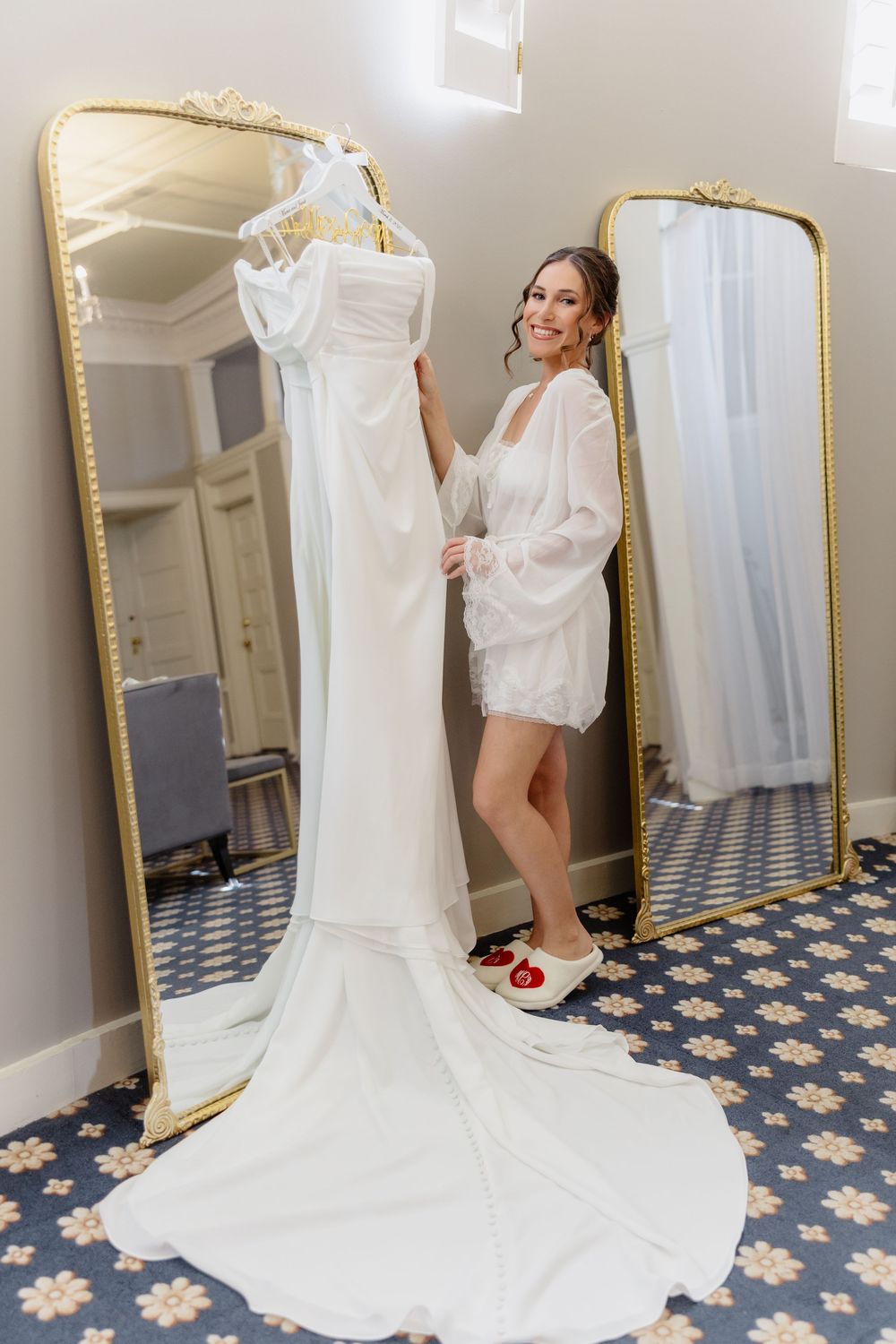 Montage of a white wedding dress being hung and displayed in a room with gold-framed mirrors and patterned carpet.