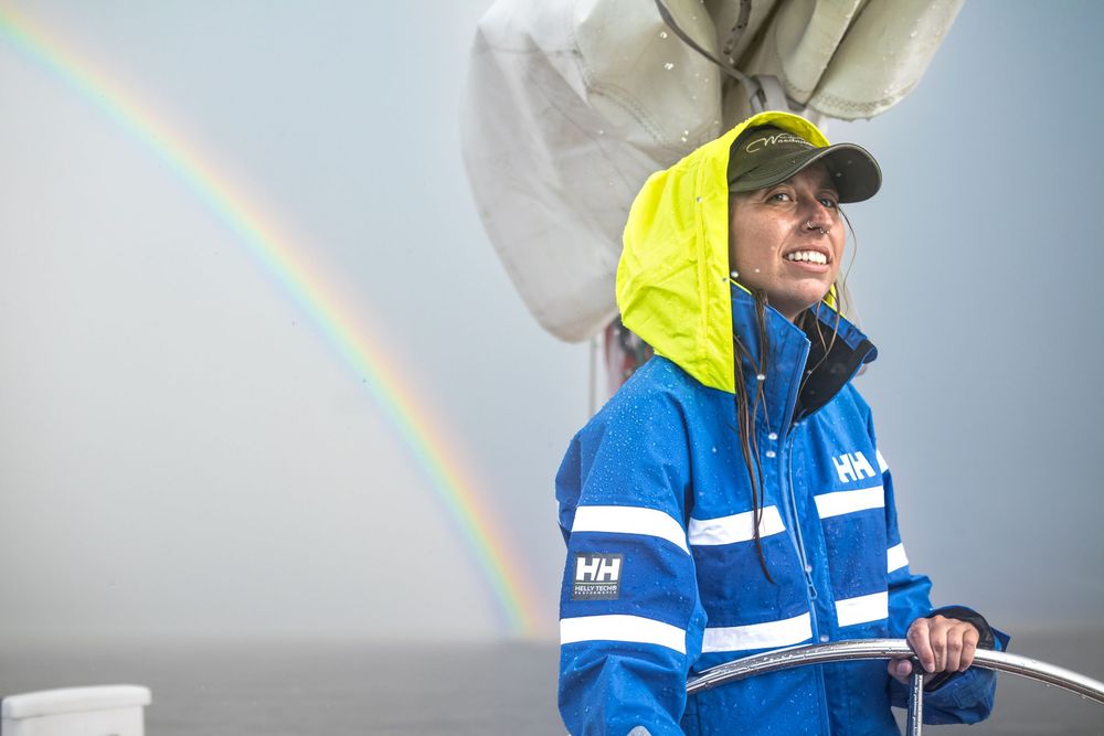 A rainbow appears after post rainstorm in the chesapeake bay for perfect brand photoshoot.