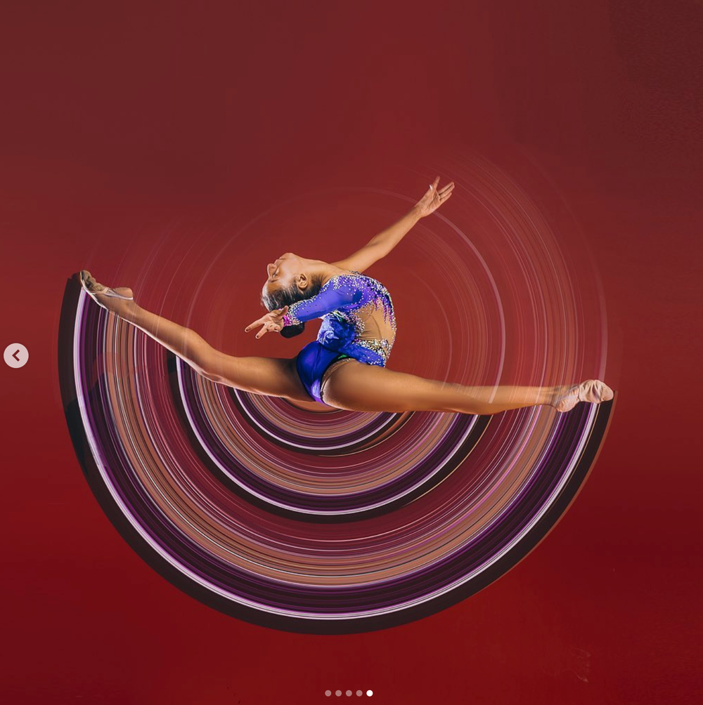 Artistic motion photography showing circular movement patterns against red backdrop - rhythmic gymnastics