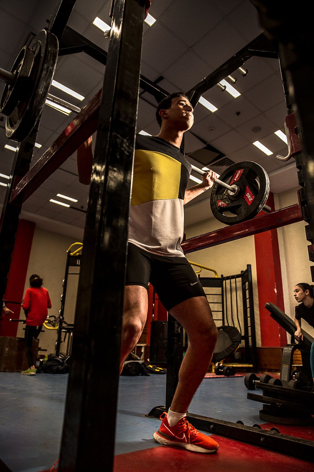 Low angle view of gym equipment and exercise machines in fitness facility.