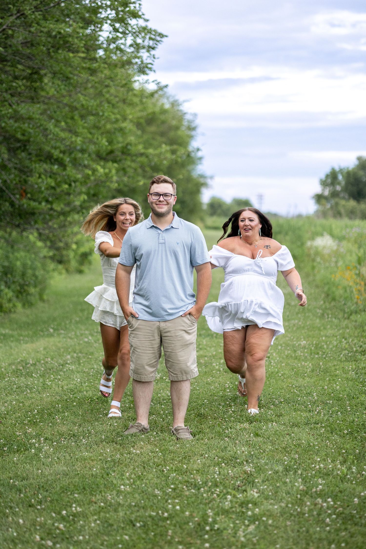 Springfield, IL photographer captures siblings running during a photo session at Centennial Park in Central IL