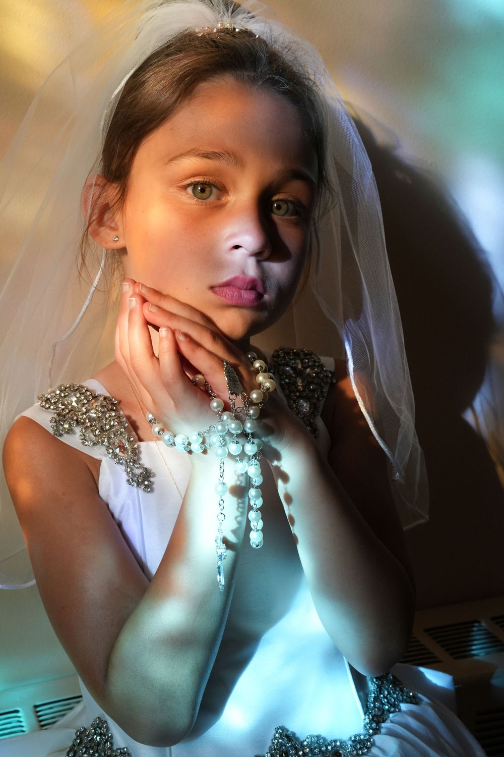 Ethereal bridal portraits with dramatic lighting and crystal embellishments.