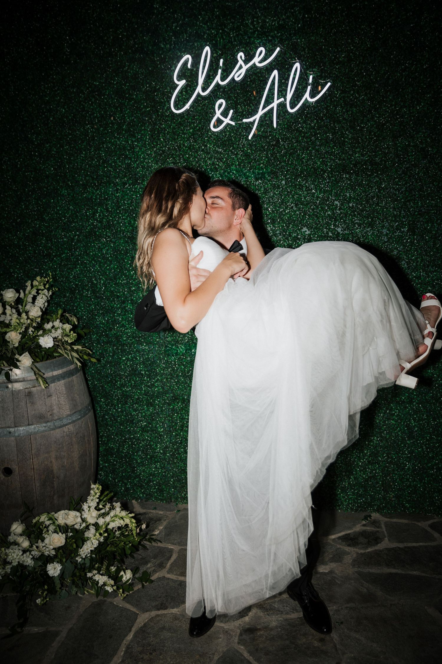 bride and groom in a candid photobooth moment
