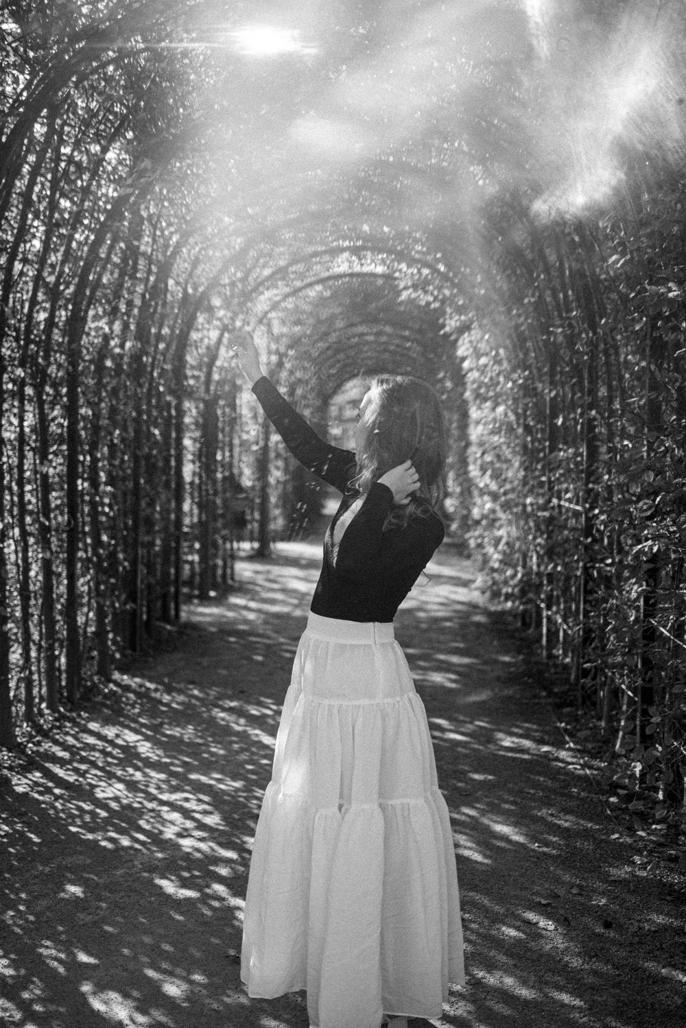 black and white portrait of the woman in garden of Rijkmuseum, Amsterdam