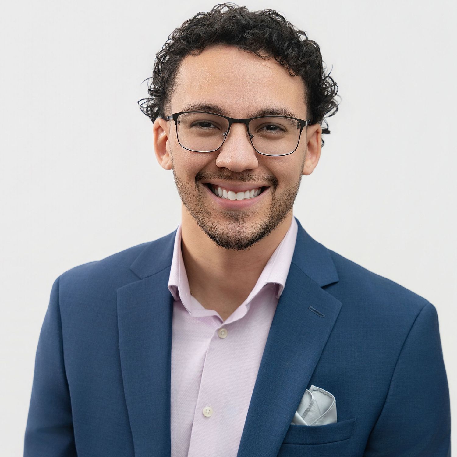 Professional headshot against white background.