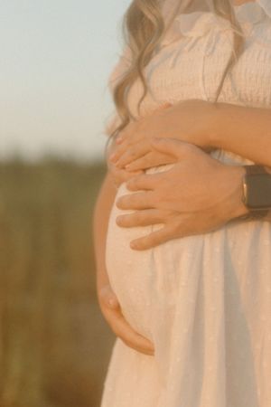 Dreamy vintage grain maternity portrait at Lake Arrowhead Texas, earthy soulful photography.