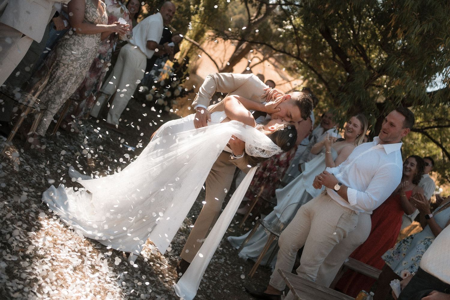 A series of wedding celebration photos showing confetti being thrown at a couple outdoors on a sunny day.