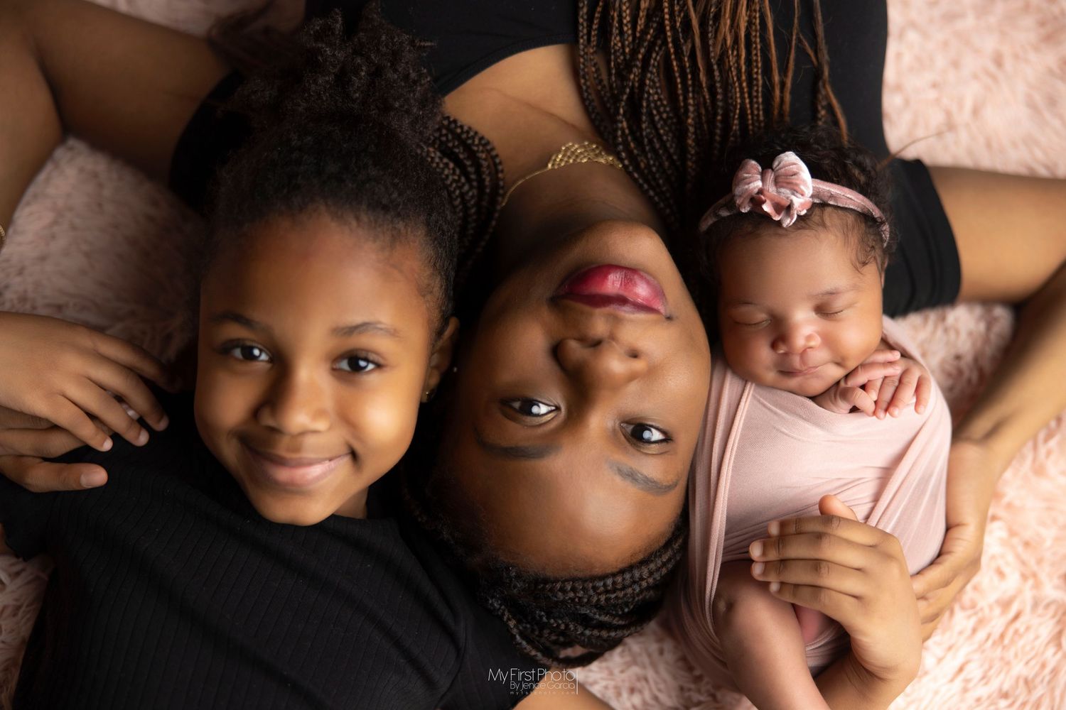 A collection of heartwarming newborn baby portraits arranged in a horizontal collage on a pink background.