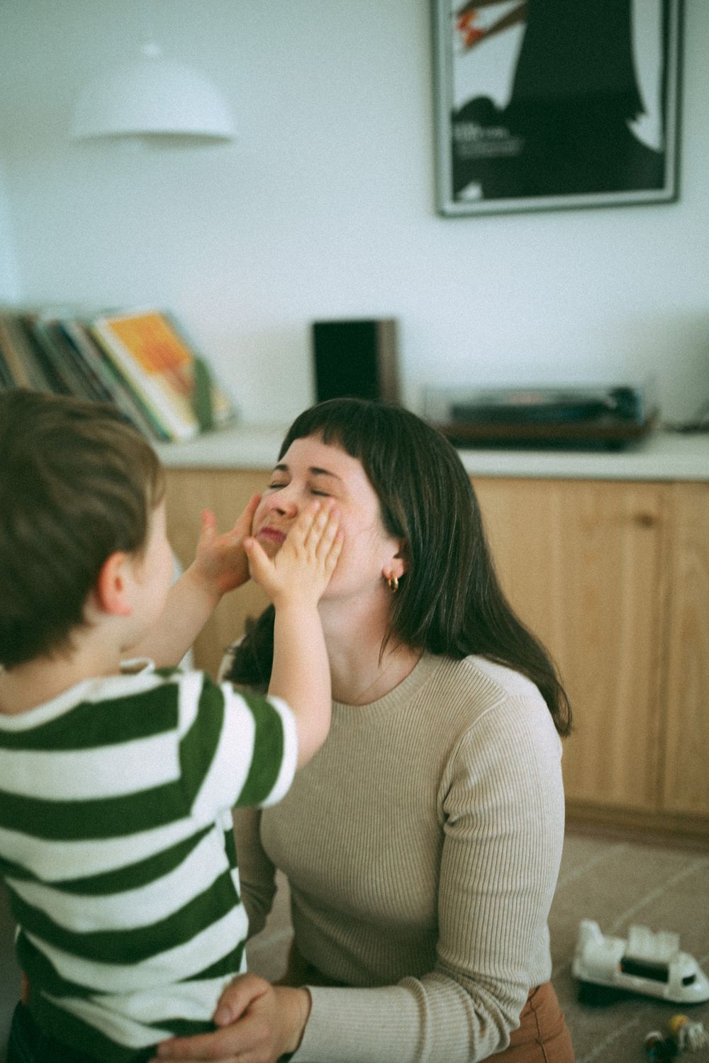 A series of candid photos showing playful interaction and laughter between two people in a cozy indoor setting.
