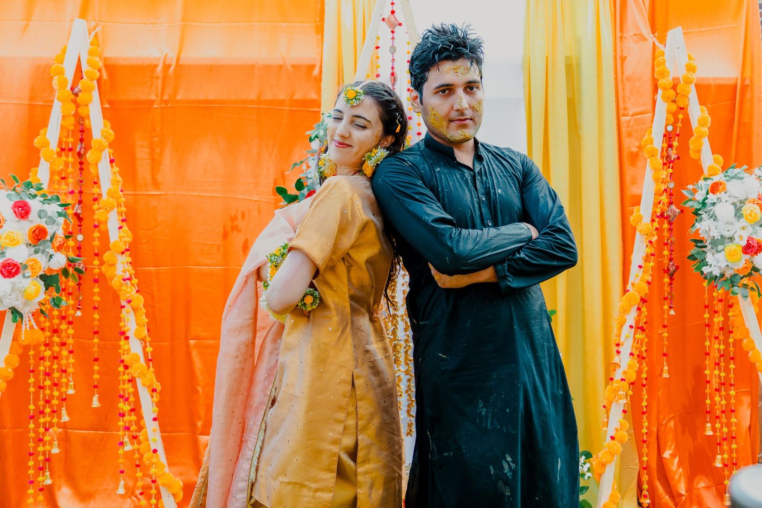 Bride and Groom poses during traditional Haldi rituals