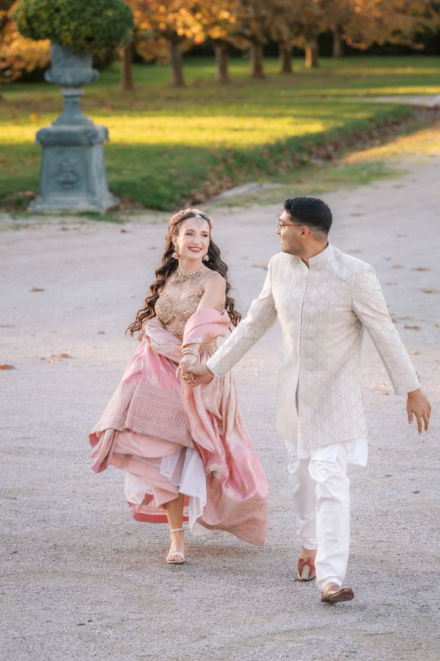 playful south asian wedding couple running Herdade do Peru gardens Portugal