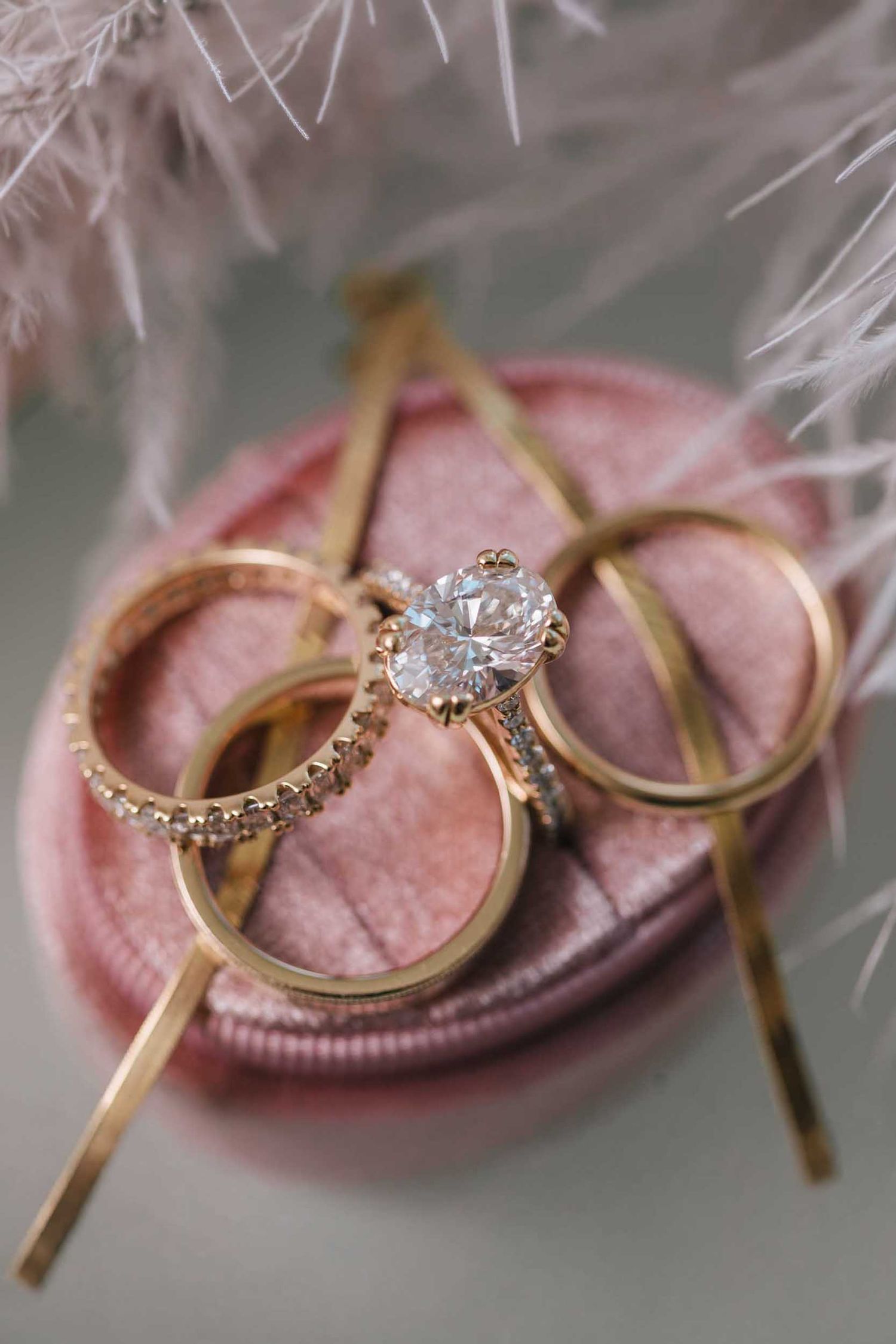 Close-up of diamond engagement ring and wedding bands photographed during Boston wedding day preparations