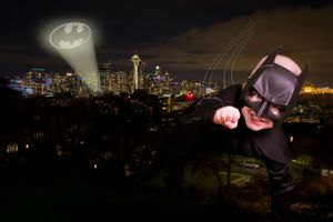 A boy dressed as batman flying over Seattle.Jackie Phairow Photography batman portrait