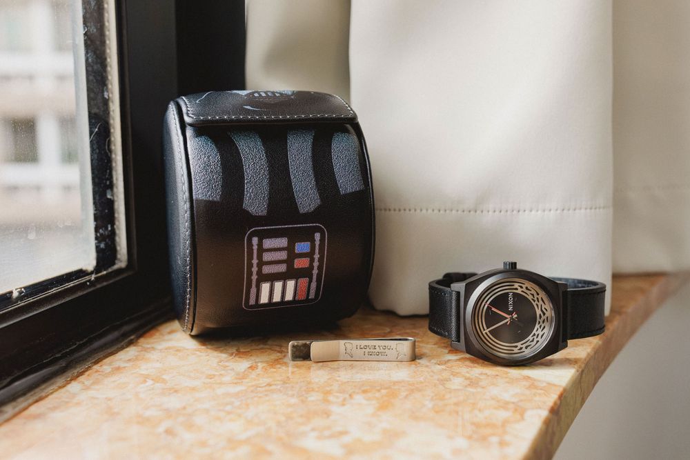 Star Wars inspired groom accessories including watch and cufflink during wedding preparations.