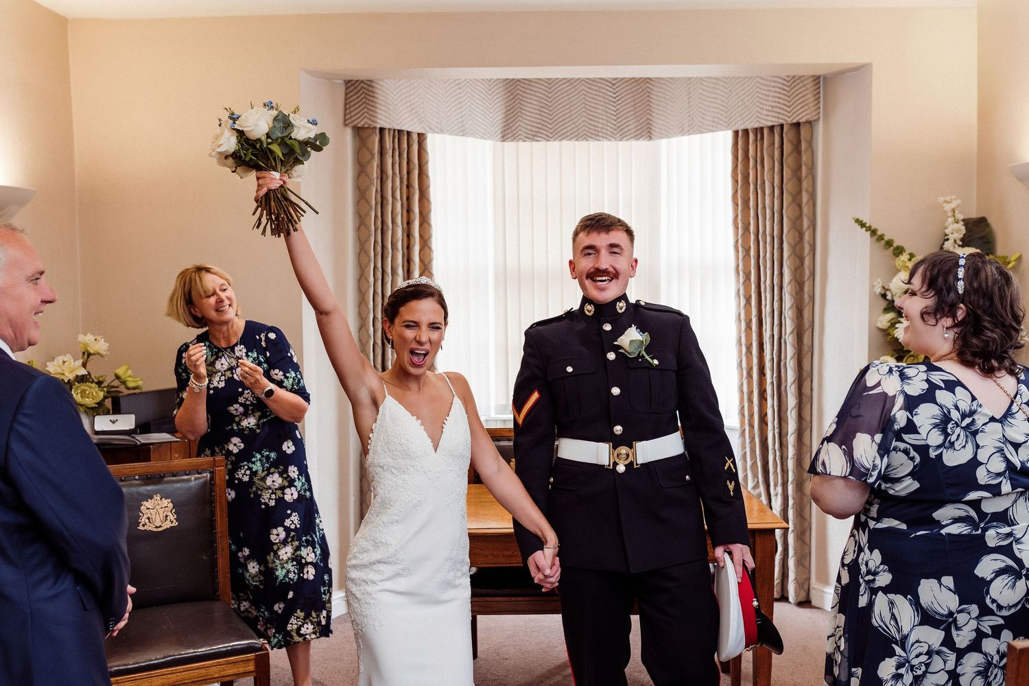A sequence of candid wedding reception moments showing guests and a couple celebrating indoors.