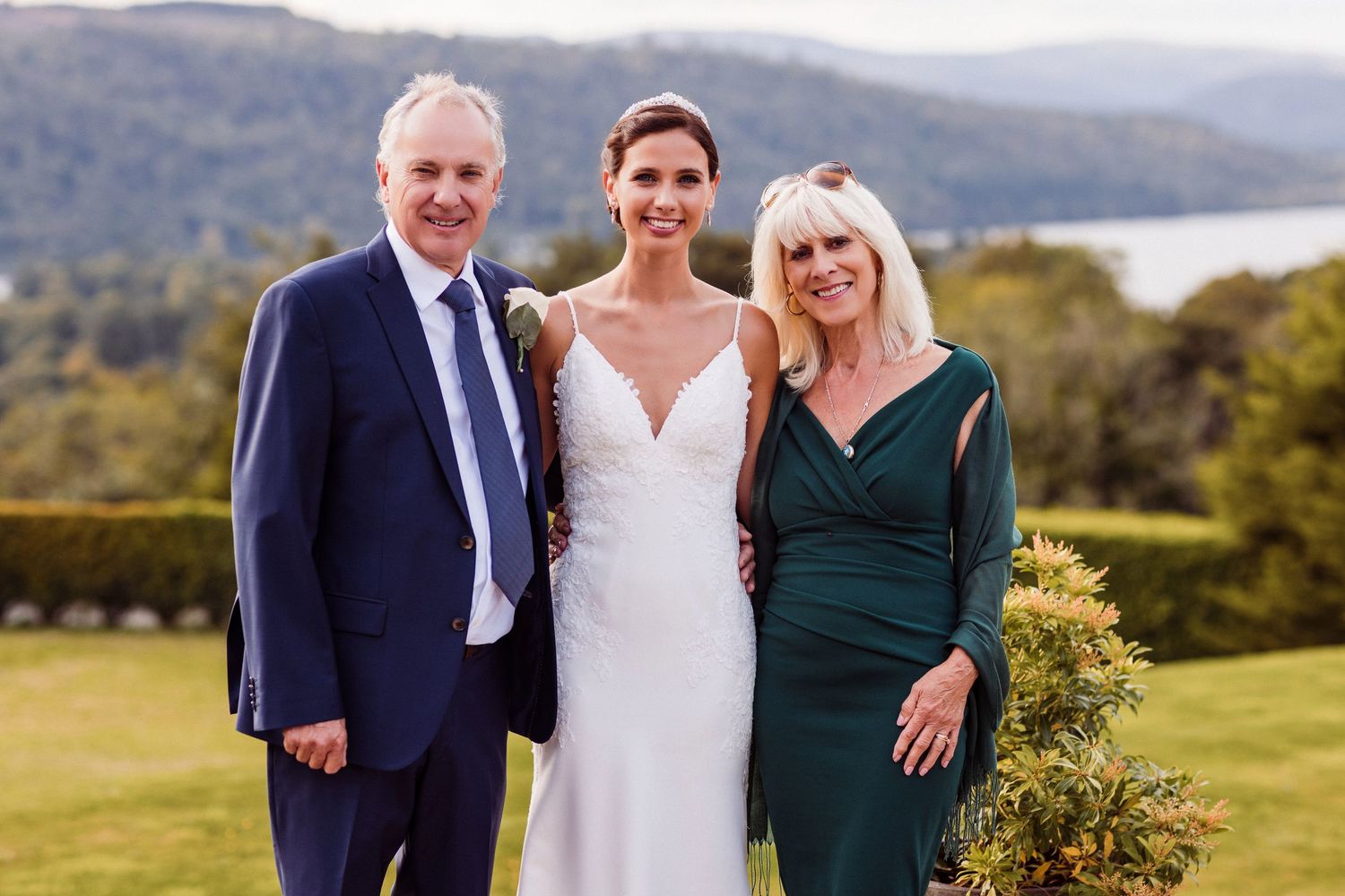 Outdoor wedding portraits with mountains and natural scenery in the background.
