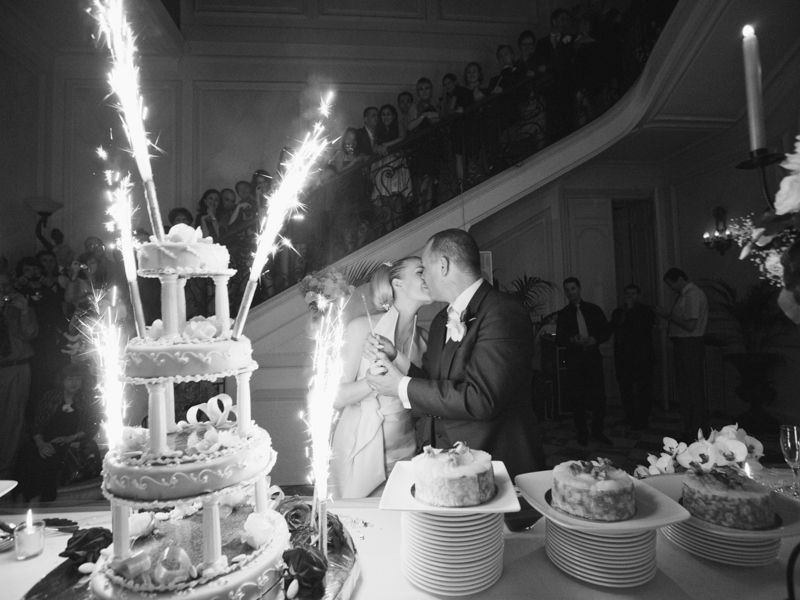Bride and groom cutting their wedding cake at Château de Santeny near Paris