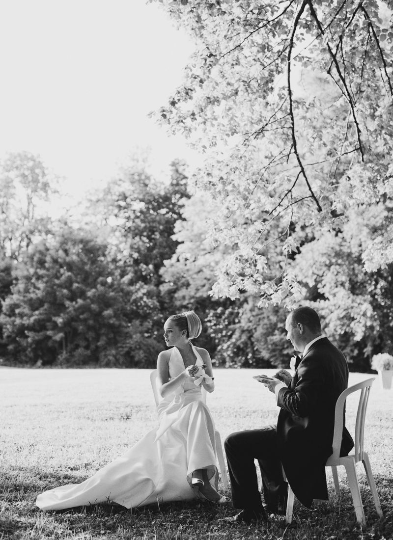 Bride and groom sharing a quiet moment in the gardens of Château de Sant