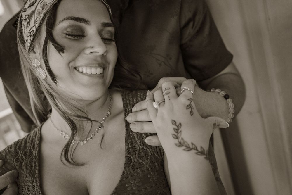 A series of candid black and white wedding photos showing joyful moments and emotional expressions during a celebration.