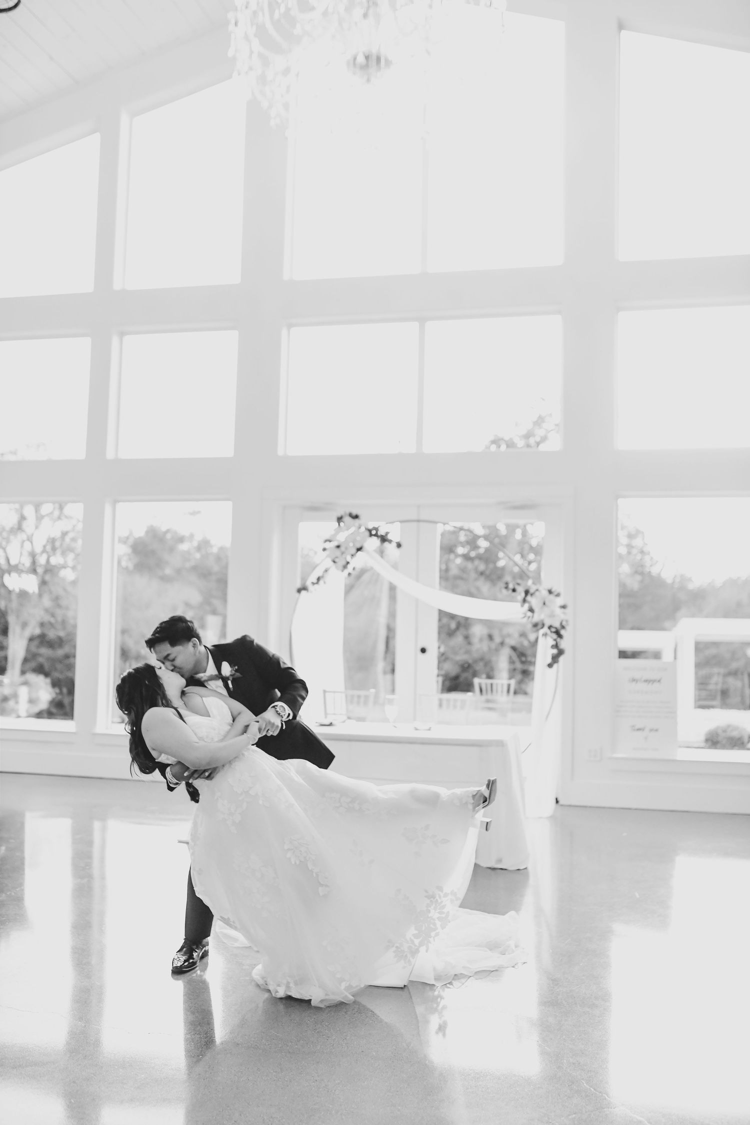 romantic moment of groom dipping his new bride for their first dance at the firefly gardens