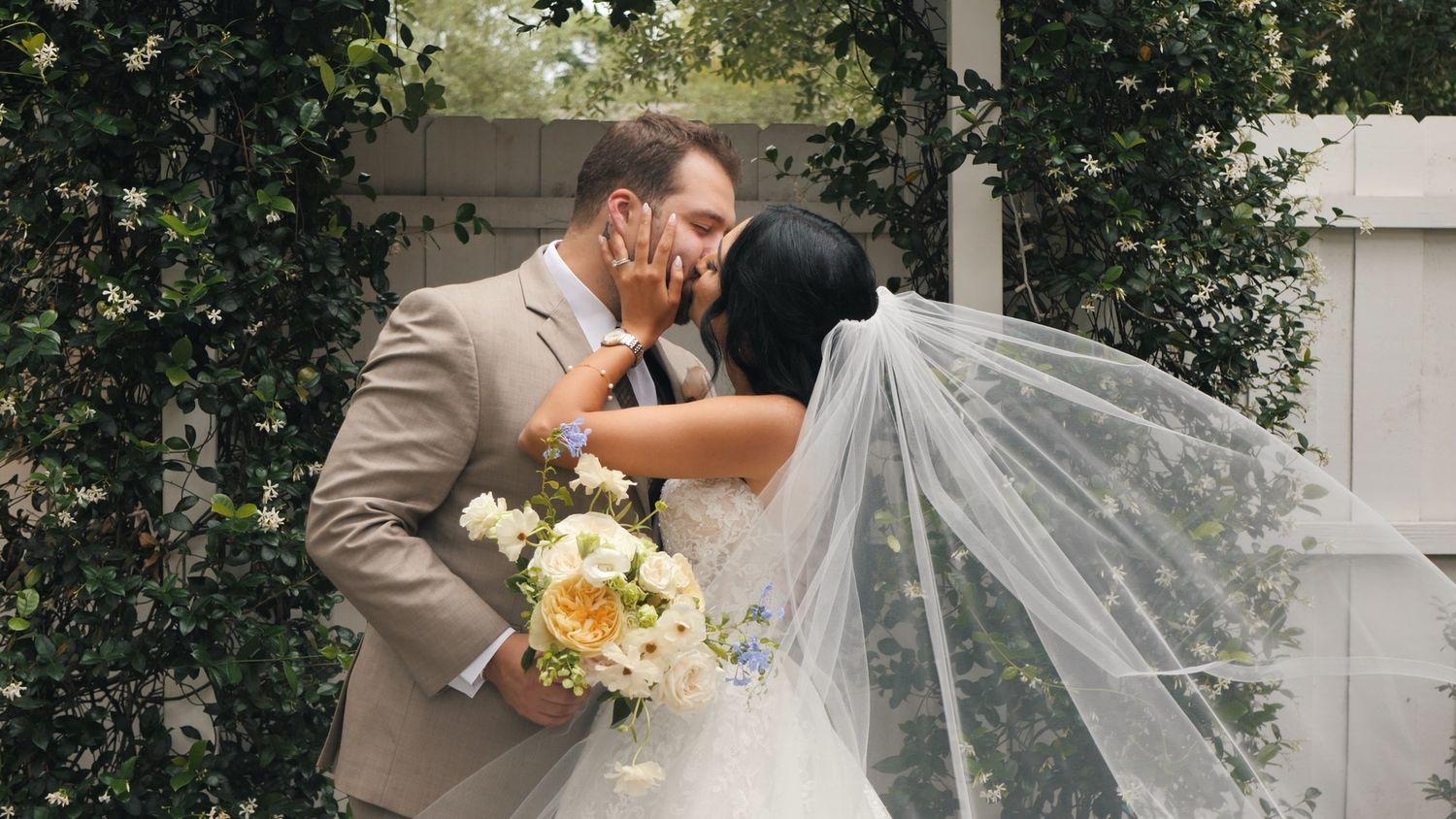 First kiss of newlyweds at elegant Historic Venue 1902 in Central Florida
