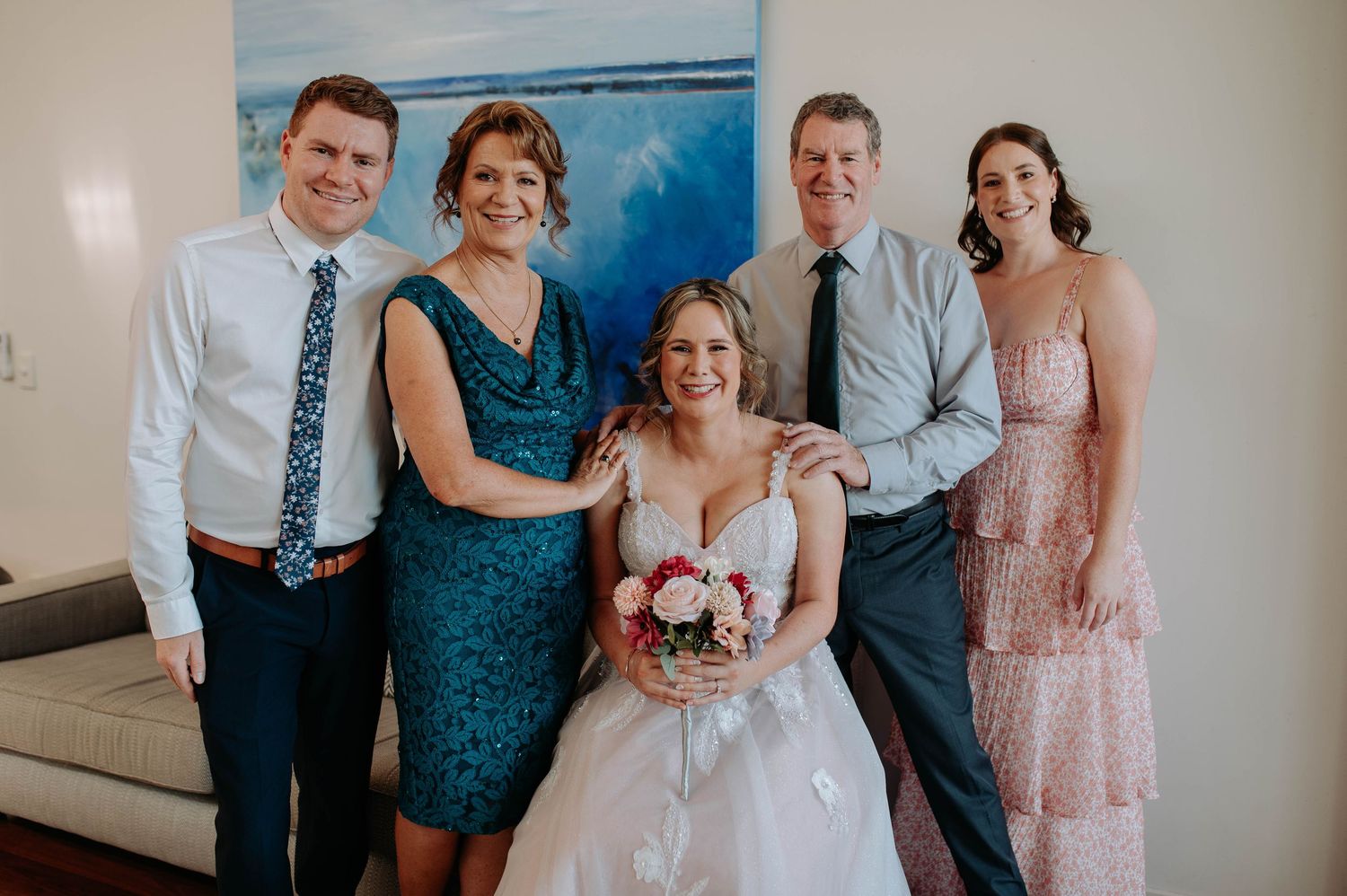 A group photo collage of wedding party members in formal attire posing together against a light background.