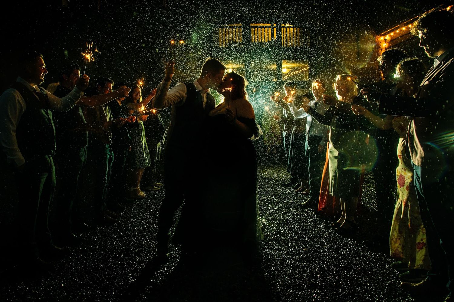 A series of dark nighttime photographs showing people holding glowing lanterns in a mysterious outdoor setting.