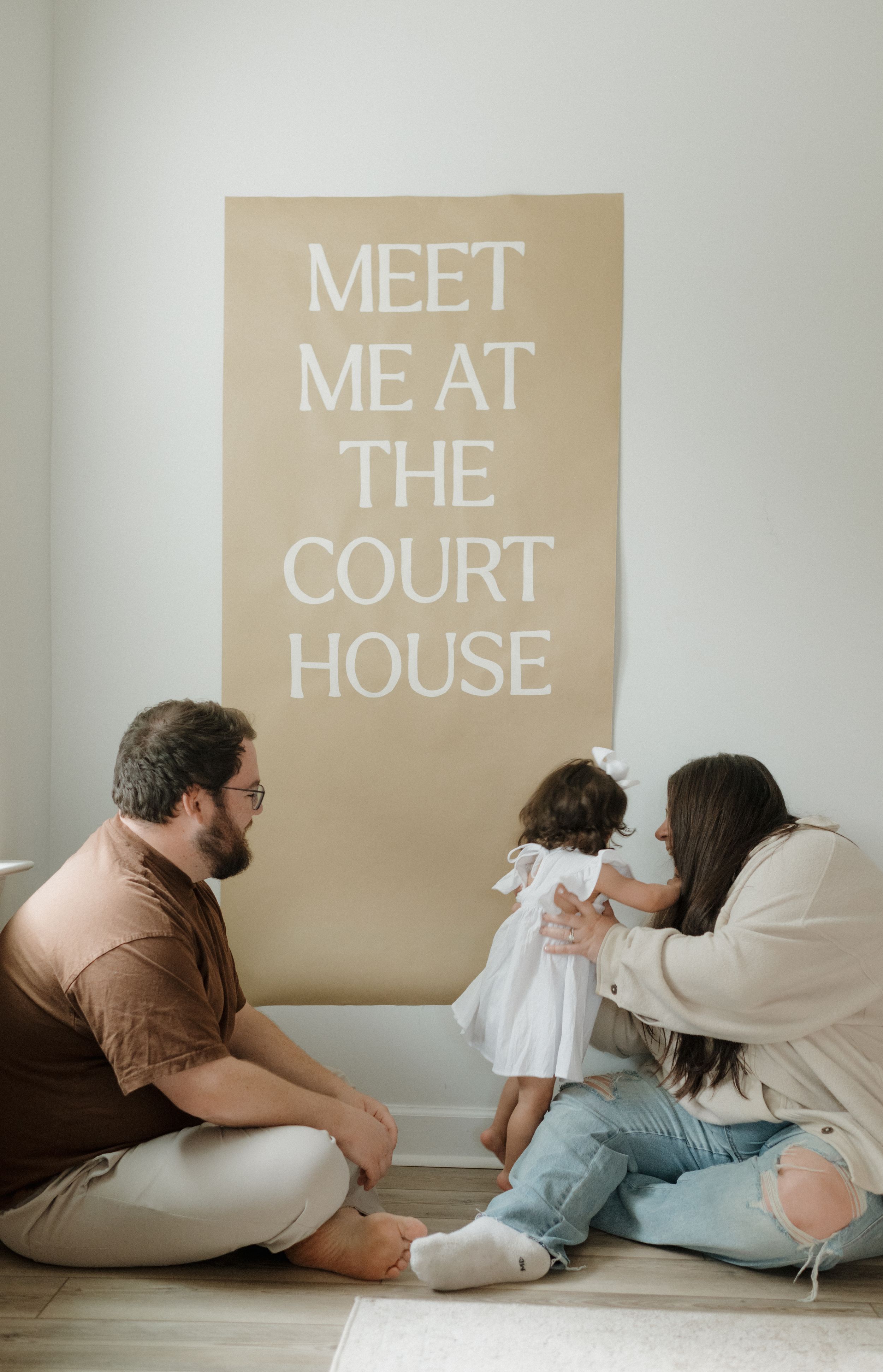 A creative photo series showing text on tan paper spelling out 'Meet Me At The Court House'.