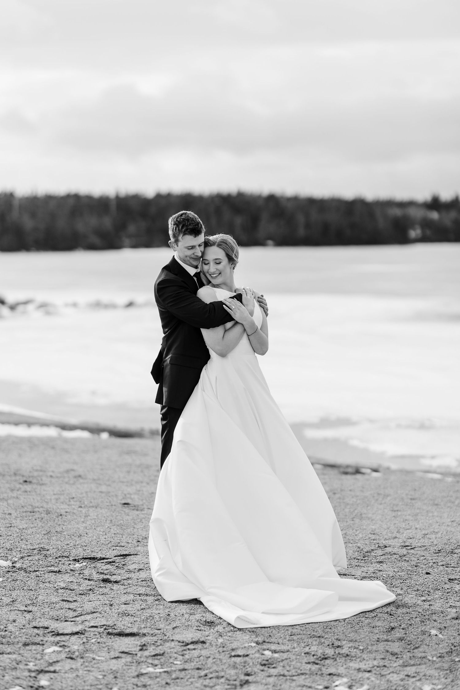 A romantic black and white wedding photo sequence shows a couple dancing together on a beach.