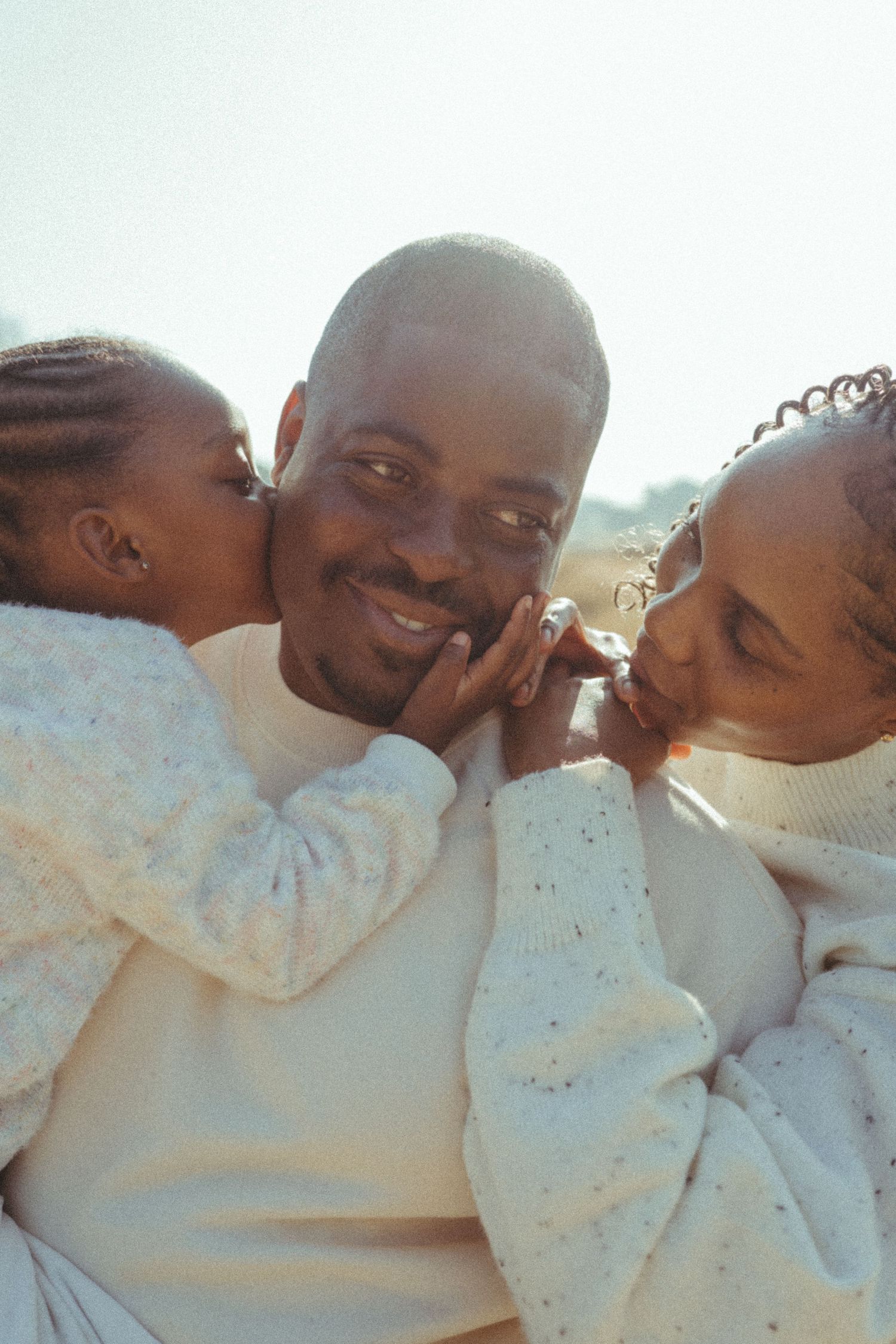 An intimate series of close-up moments between people in white clothing.