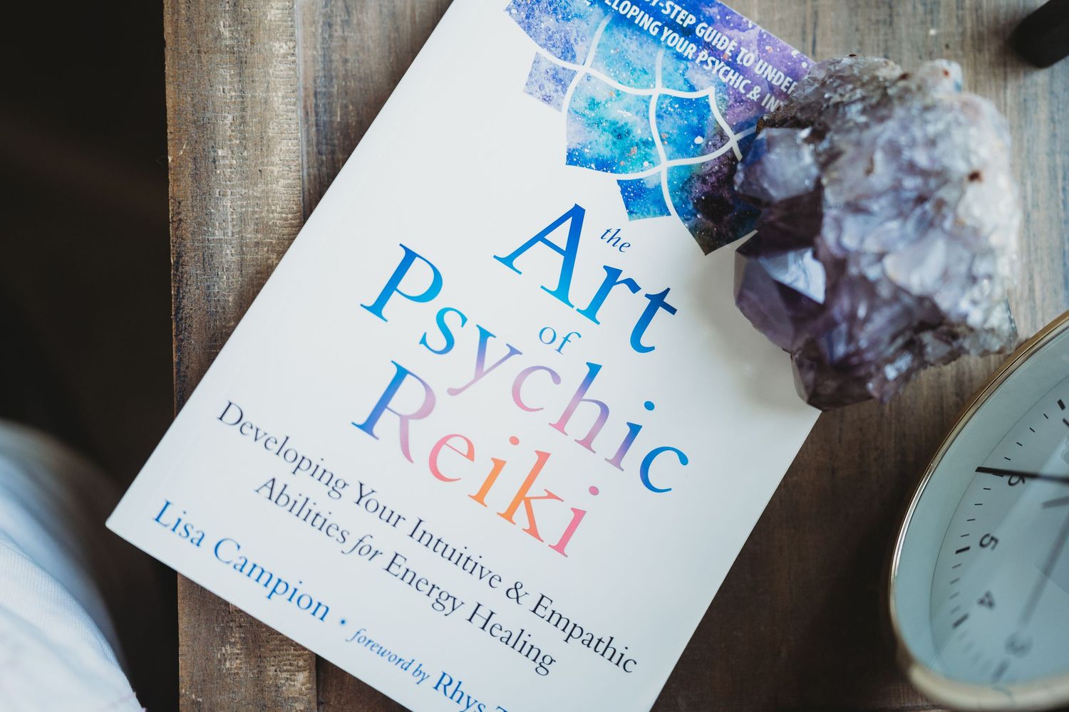 Holistic healing certificates and paperwork for Reiki and other alternative therapy practices laid out on a surface.