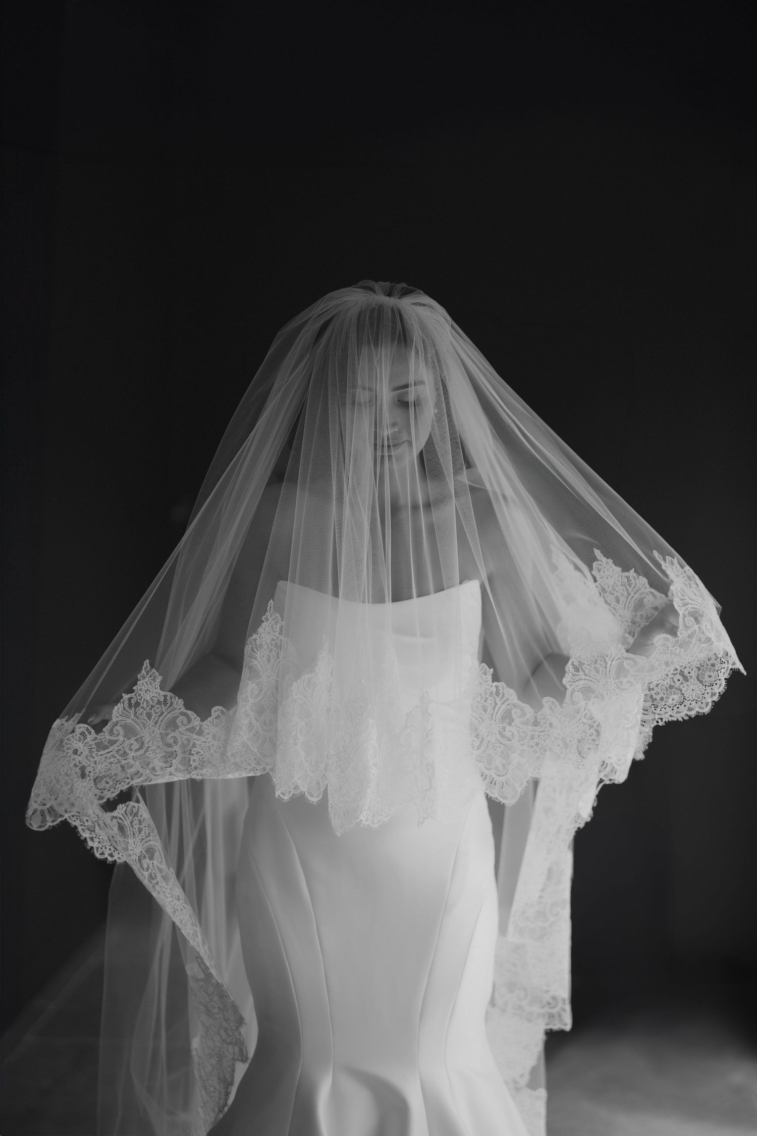 veiled bride at Bibury Farm Barns in the Cotswolds