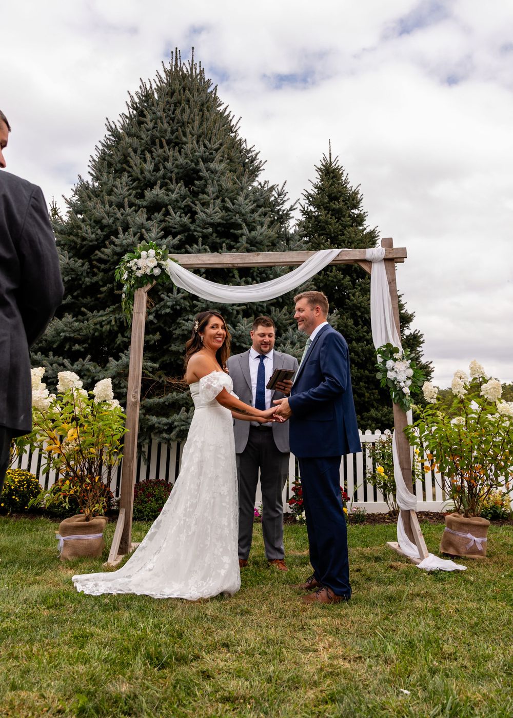 Bride & Groom at backyard wedding garden ceremony in Omaha, Nebraska. - BrightSide Photography