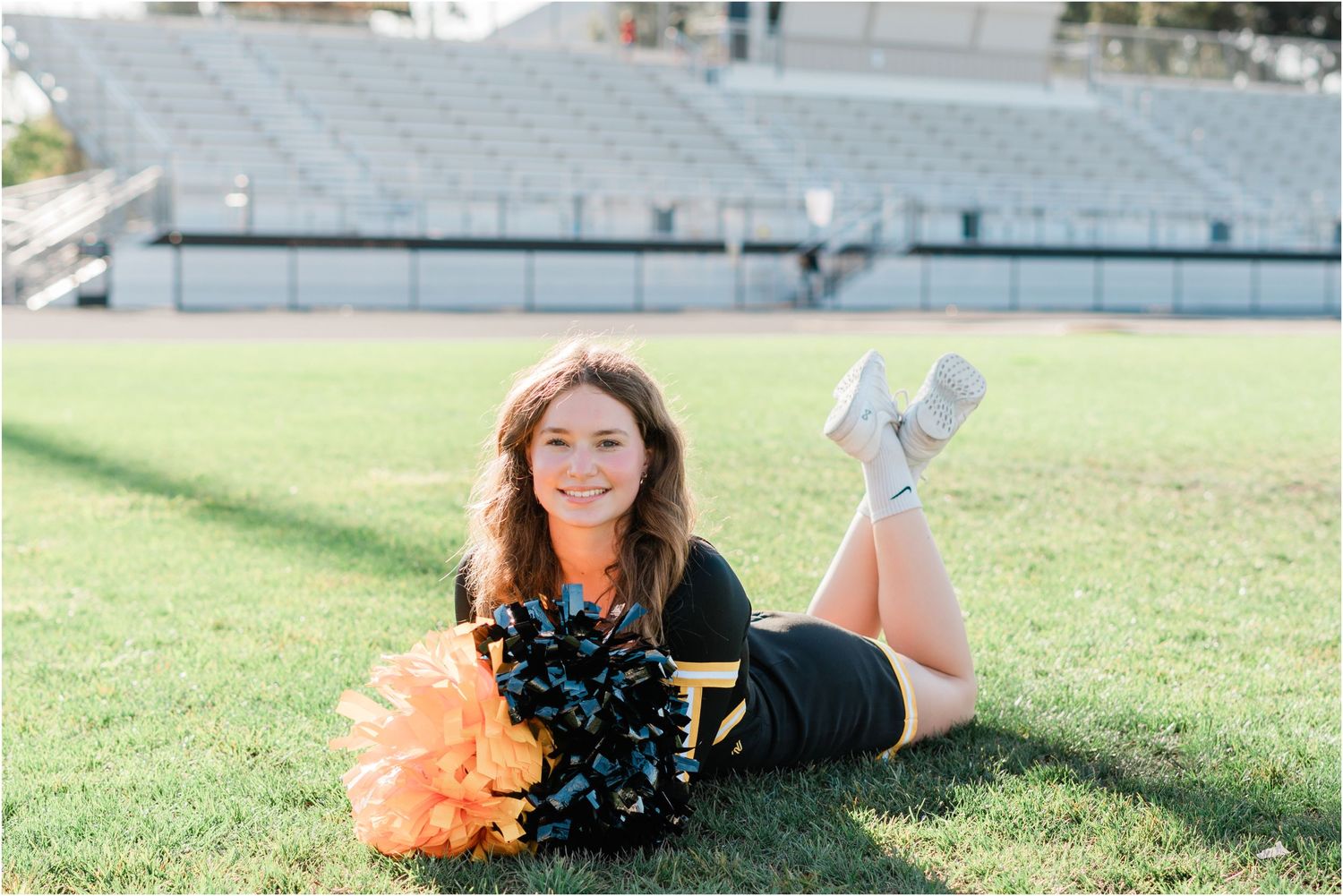 SLO High Senior on Varsity Cheer at Holt stadium for SLO High Cheer team photos