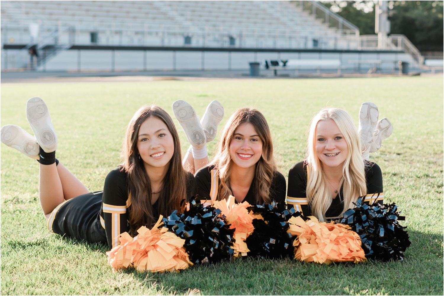 varsity cheer team photos for San Luis Obispo High School with teammates in cute laying down cheer pose