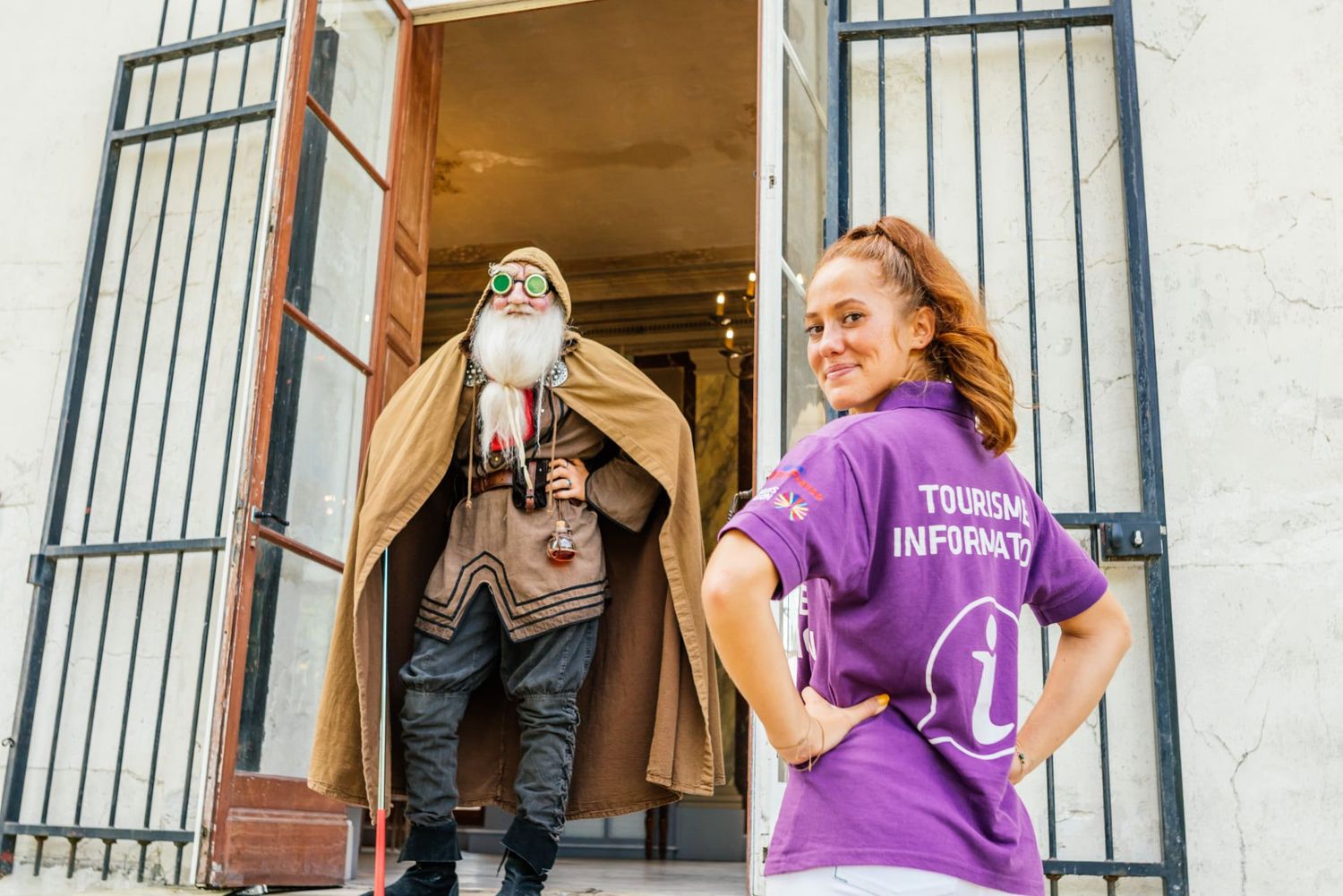 Volunteers in purple shirts load cardboard boxes into a truck during a community service event.