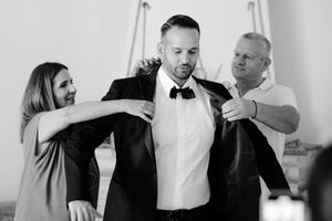 A series of black and white candid moments showing people interacting at a formal event.