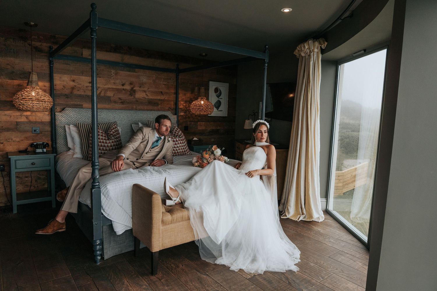 Bride and groom relaxing in the penthouse at Gara Rock Hotel, Devon